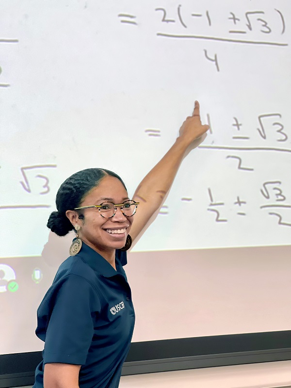 Math Major Student Pointing at Projector
