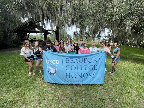 Honors Group Outdoors Holding Banner