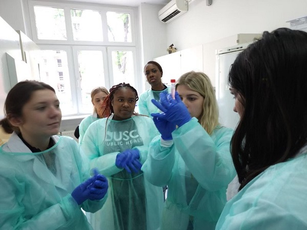 Students Studying Abroad in Lab Coats